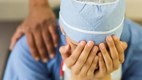 Getty Images exhausted staff