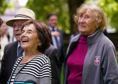 PA Media Holocaust survivors (left to right) Sir Ben Helfgott, Lily Ebert and Susan Pollack