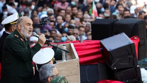 WANA NEWS AGENCY VIA REUTERS IRGC commander Maj Gen Hossein Salami speaks at a funeral for the Shah Cheragh Shrine attack in Shiraz on 29 October 2022