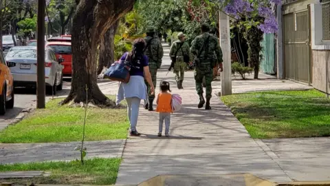 BBC Soldiers on patrol in suburban Guadalajara