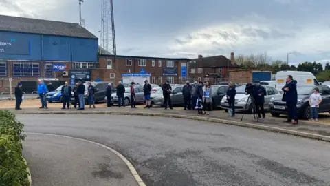 Fans gather at London Road stadium
