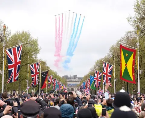 Richard Heathcote/Getty Images The Red Arrows, based at RAF Waddington, fly over Buckingham Palace
