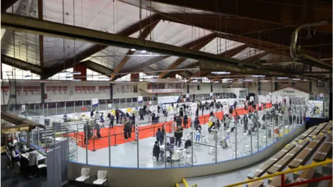 Getty Images Vaccine is being administered at the Downsview hockey arena in Toronto