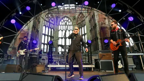 Getty Images Riding The Low, Paddy Considine (C) perform at the Terry Hall presents HOME SESSIONS music festival as part of Coventry UK City of Culture at Coventry Cathedral on July 31, 2021