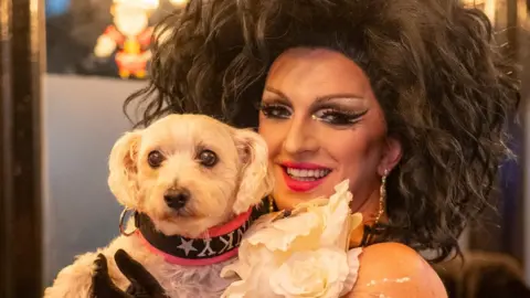 Ru Cook Photography Eddie OK Adams holding Binky the dog