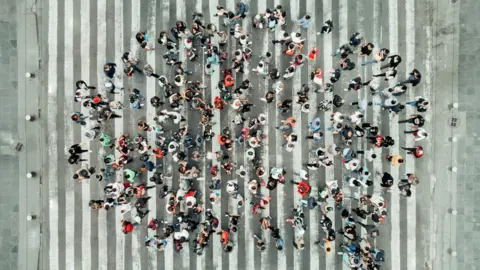 Getty Images Group of people in a circle, social bubble illustration