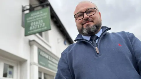 Stuart Woodward/BBC John Gillies from Adam & Greenwood Funeral Directors