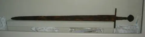 Duncan McAndrew Battlefields Trust A sword found at the site of the battle is now on display in Bury St Edmunds