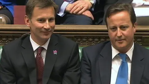 Reuters Jeremy Hunt, Britain's Culture Secretary, sits next to then Prime Minister David Cameron