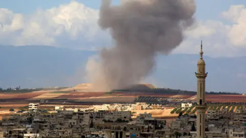 AFP Smoke rises from Khan Sheikhoun area of Idlib province after reported air strike (7 September 2019)