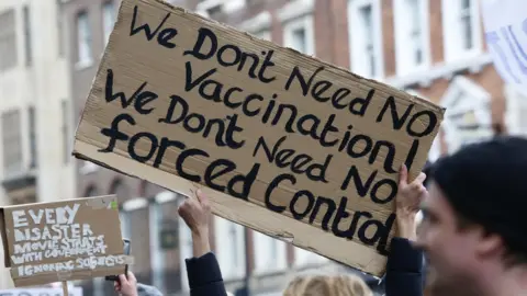 Getty Images Anti vaccination demonstrator