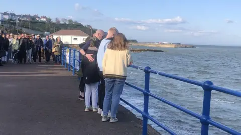 Mourners tied a white ribbon to the railings at the seafront, yards from where Alyson Nelson died