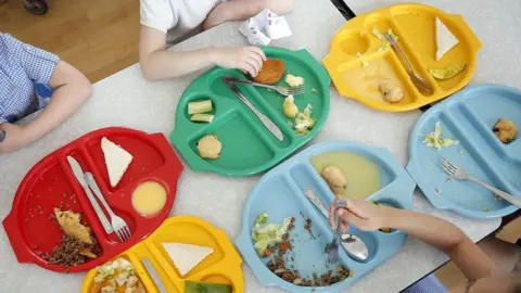 Reuters Photo from 2014 showing young pupils eating their lunch at Salusbury Primary School in north-west London.