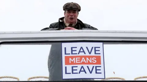 Scott Heppell/Reuters Nigel Farage looking down from the top of a bus at the first leg of the March to Leave demonstration, embarking from Sunderland to Hartlepool
