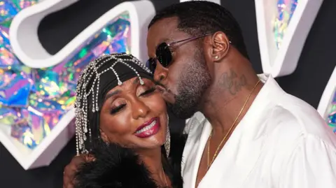 Getty Images Sean Combs kisses his mother Janice on the cheek on the red carpet at the 2023 MTV Awards