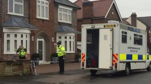 Police cordon outside a house in Holmfield Avenue in Leicester
