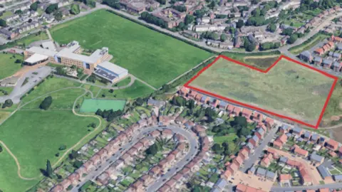 Google A map showing the land earmarked for new homes near Beaumont Leys School in Leicester.