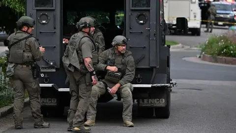 SWAT officers on the scene after an attack in Boulder, Colorado that targeted a group calling for the release of hostages held in Gaza.