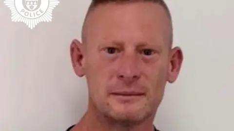 West Mercia Police A custody image of a man who is looking directly at the camera