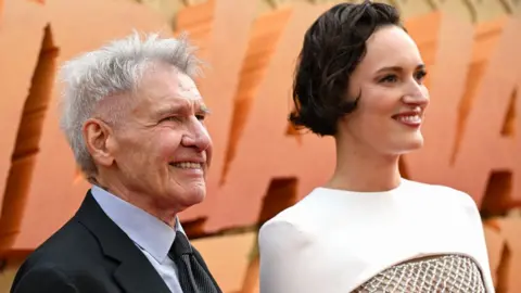 Phoebe Waller-Bridge and Harrison Ford attend the UK premiere of Indiana Jones and the Dial of Destiny at Cineworld Leicester Square on June 26, 2023 in London, England