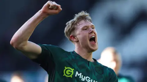 Josh Coburn celebrates after scoring for Millwall