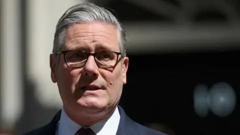 Sir Keir Starmer wearing glasses
