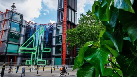 Getty Images C4 office in central London. A huge big 4 in green tubes at the front of a glass building.