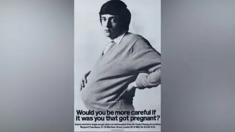 History of Advertising Trust A poster showing a man with dark hair wearing a jumper over a checked shirt stretched over his pregnant torso. Underneath there is a sentence asking, Would you be more careful if it was you that got pregnant? 