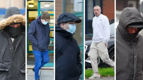 PA Media A collage of five defendants leaving Swindon Magistrates' Court. From left to right, Mr Doyle is wearing a long dark coat with a furry hood. He is also wearing a black scarf covering the lower half of his face. Mr Wilkins is wearing blue jeans, black shoes, a dark blue coat, a blue Covid-style mask and a brown woolly hat. Mr Hassan is wearing a dark grey flat cap, a black coat and also a light blue Covid-style mask. Mr Hamilton is wearing a white jumper.  Mr Macksoni is hiding his face under a hat and the hood of his black coat. 