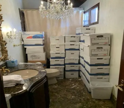 Reuters White file boxes are stacked inside a bathroom