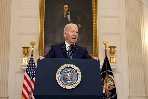 Chip Somodevilla/Getty Images US President Joe Biden speaks behind a podium at the White House