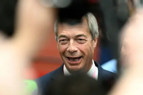 Nigel Farage grinning
