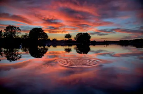 Henry Szwinto A pond at sunset