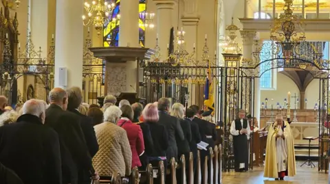 People paying their respects at Derby Cathedral this evening