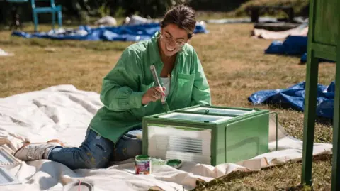 Interior Design Masters/BBC One Roisin Quinn painting a piece of furniture