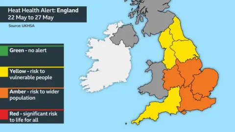 Map of England and Wales with the West and East Midlands, East of England, the South East and London highlighted in amber meaning there is an increased risk of heat related illness across the wider population. The North East, North West, Yorkshire and The Humber and South West of England are highlighted in yellow, meaning a risk to vulnerable people. The heat health alerts are in force until 17:00 on 27 May.
