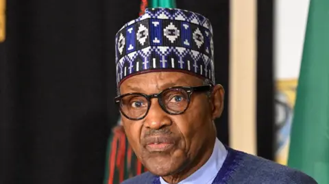 Nigeria's President Muhammadu Buhari delivers remarks to journalists at the end of his meeting with Portuguese President Marcelo Rebelo de Sousa (not seen) in Belem Presidential Palace at the beginning of his State Visit to the country on June 30, 2022, in Lisbon, Portugal