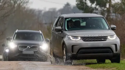 Vehicles, believed to be police, near Andrew's Sandringham home on Thursday morning.