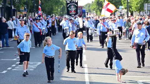 Pacemaker Children march down the road in Holywood during the parade