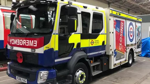 TfL A truck with hi viz livery in a garage