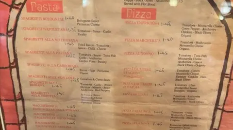 Casa Italia A menu with dishes including spaghetti bolognese and a margherita pizza with prices ranging from £1.40 to £1.45. 