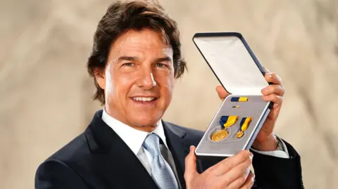 PA Media Actor Tom Cruise after being presented with the US Navy Distinguished Public Service Award by US