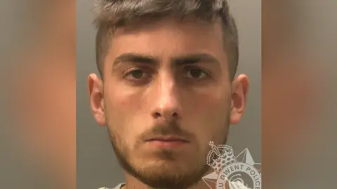 Gwent Police A custody image of David Sisman who has brown hair, a beard and a moustache and is looking directly at the camera