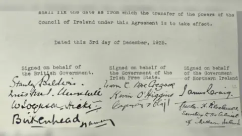 PRONI - The Deputy Keeper of the Records A white page with an agreement on it which has been signed by the British Government, the Government of the Irish Free State and the Northern Ireland Government.