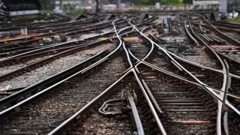 Shutterstock A series of rail tracks, criss-crossing at a busy junction