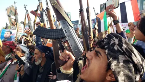 EPA armed Houthi supporters participate in protests against Israel and the US in Sanaa, Yemen (December 27, 2024)