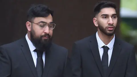 PA Mohammed Fahir Amaaz and Muhammed Amaad (left), arrive at Liverpool Crown Court