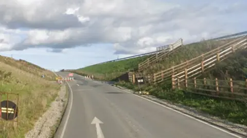A road with a junction on the right