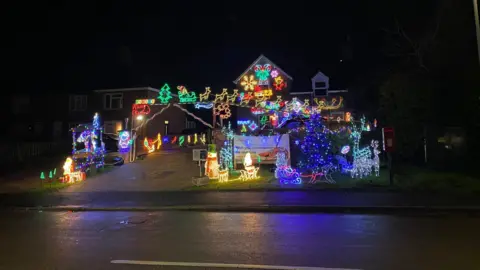 Adam Shailer Christmas decorations display in front of a house