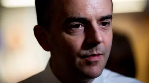 A close up shot of health secretary James Murray
